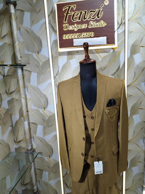 Brown checkered 3-piece men’s suit displayed on a mannequin at Fenzi Designer Studio.