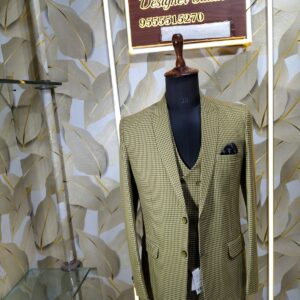 “Three-piece checked suit displayed on a mannequin at Fenzi Designer Studio”