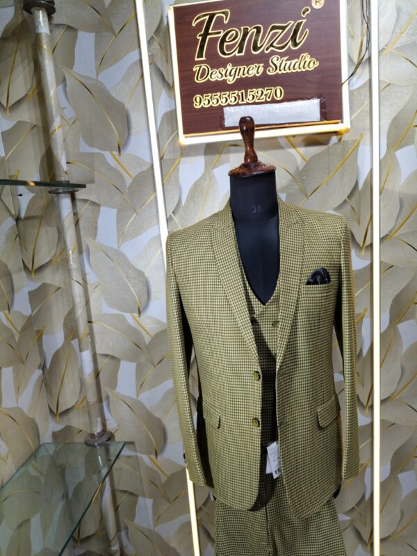 “Three-piece checked suit displayed on a mannequin at Fenzi Designer Studio”