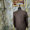 Elegant brown checked 3-piece suit displayed on a mannequin with blazer, waistcoat, and trousers.