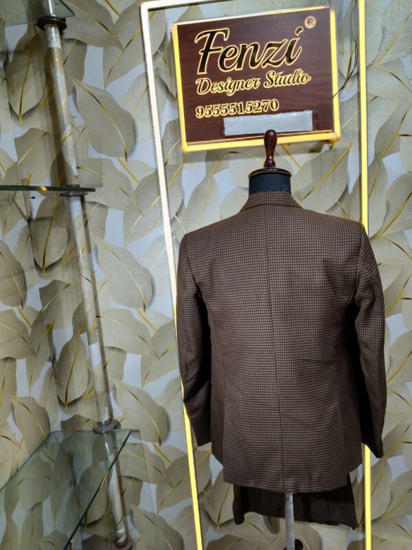 Elegant brown checked 3-piece suit displayed on a mannequin with blazer, waistcoat, and trousers.