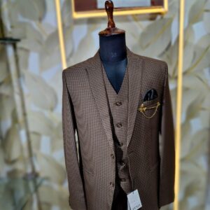 Elegant brown checked 3-piece suit displayed on a mannequin with blazer, waistcoat, and trousers.