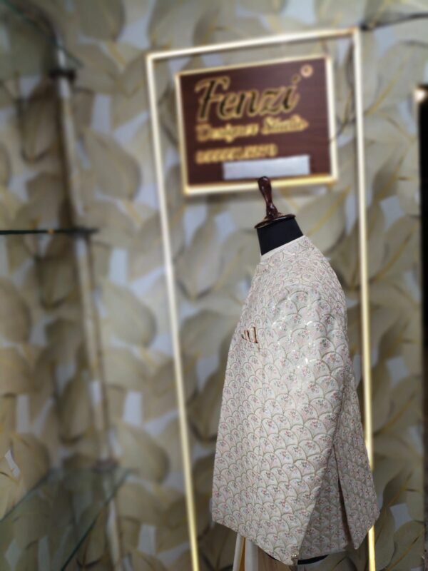 “Elegance Reimagined — Step into timeless sophistication with our Ivory Embroidered Jodhpuri Suit, crafted for men who appreciate heritage, luxury, and a distinct royal aura.”