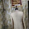Cream-gold designer Jodhpuri suit on a mannequin
