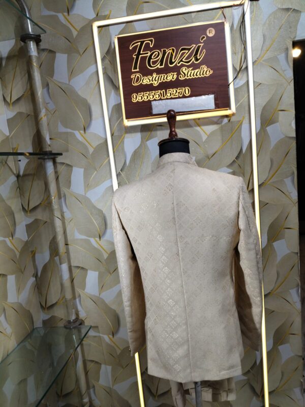 Cream-gold designer Jodhpuri suit on a mannequin
