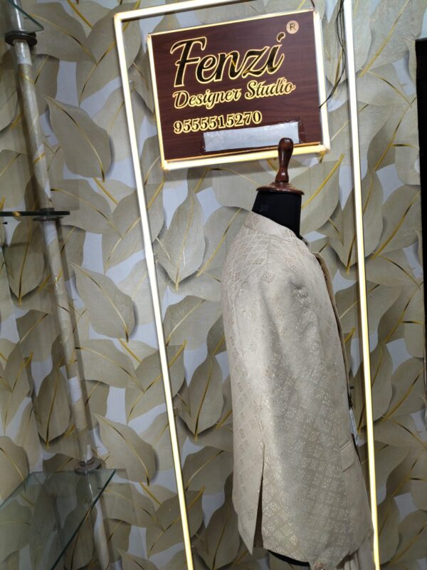 Cream-gold designer Jodhpuri suit on a mannequin