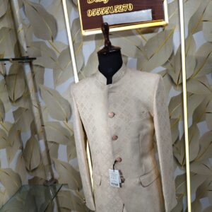 Cream-gold designer Jodhpuri suit on a mannequin