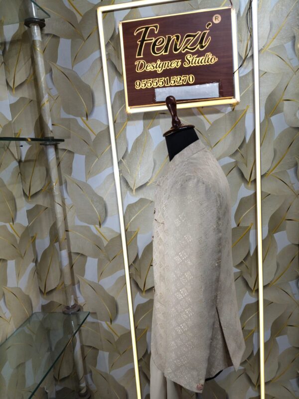 Cream-gold designer Jodhpuri suit on a mannequin
